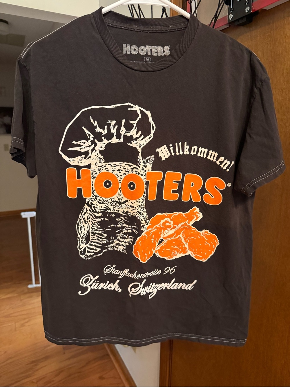 Hooters Black Tee with Orange and White Graphic